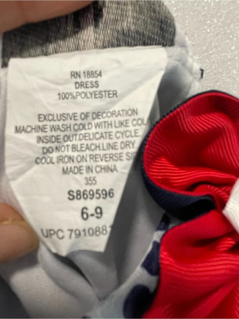 Rare Editions Gray Polka Dot Bib with Red Flower Accent